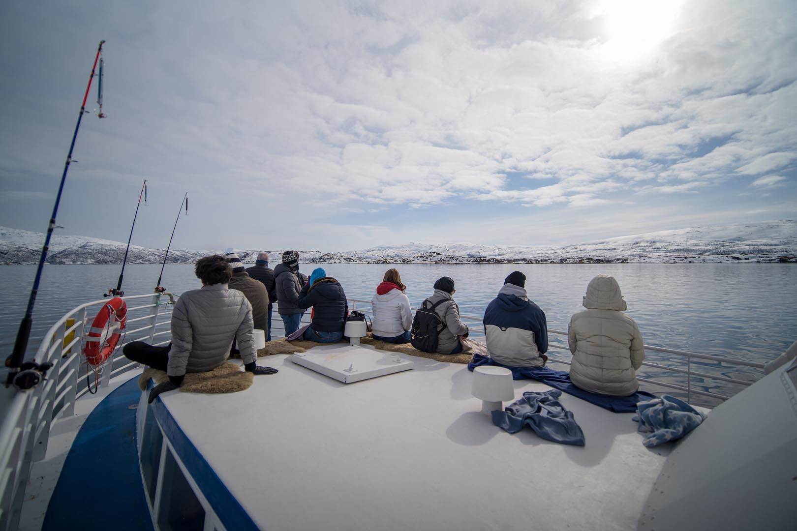 Travellers enjoying a summer fjord trip near Tromsø