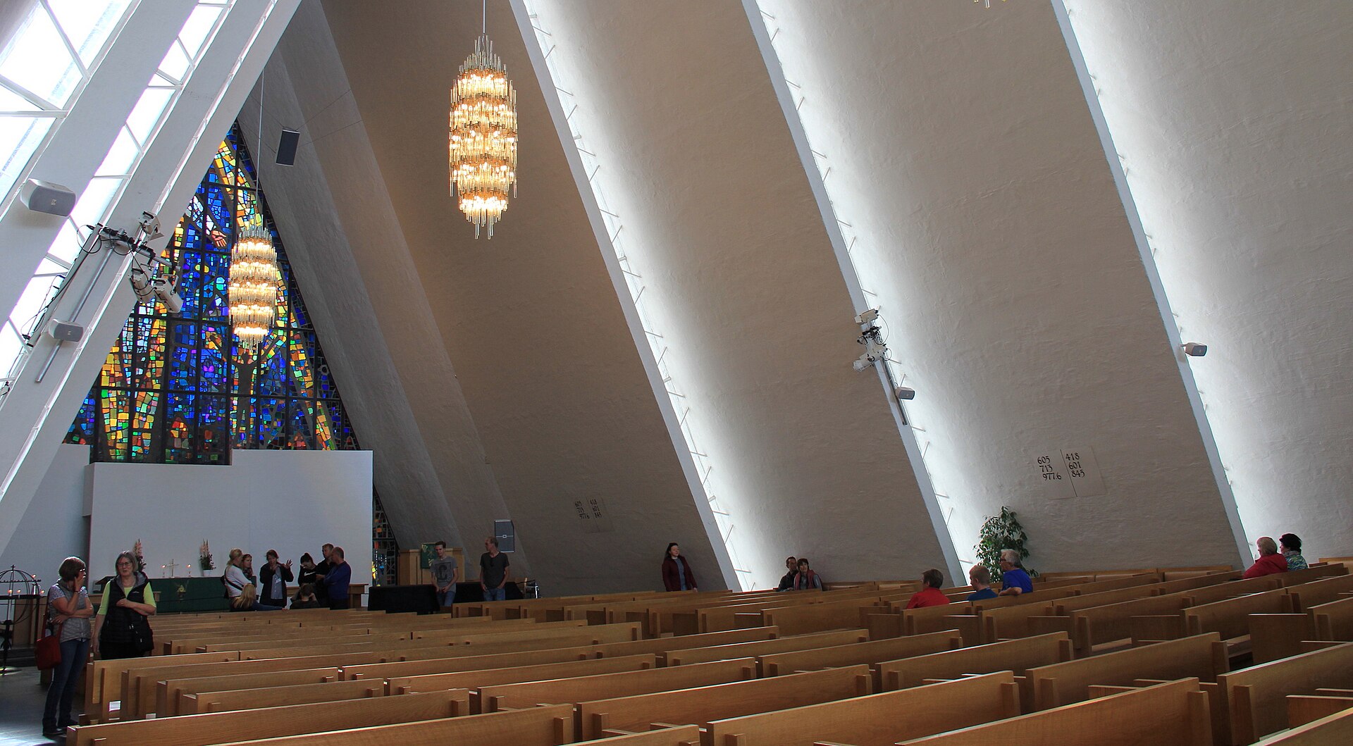 Pews, chandeliers and part of the glass mosaic inside the Arctic Cathedral