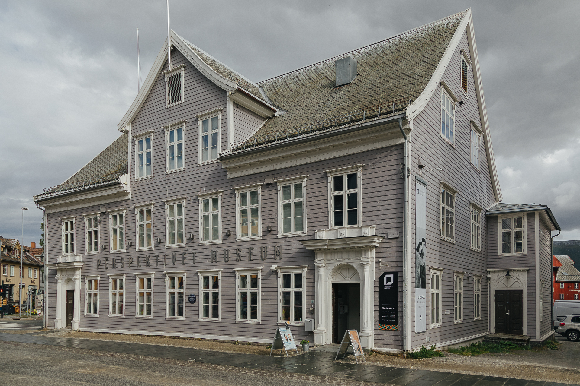 The grey wooden Perspektivet Museum building and its entrance on Storgata