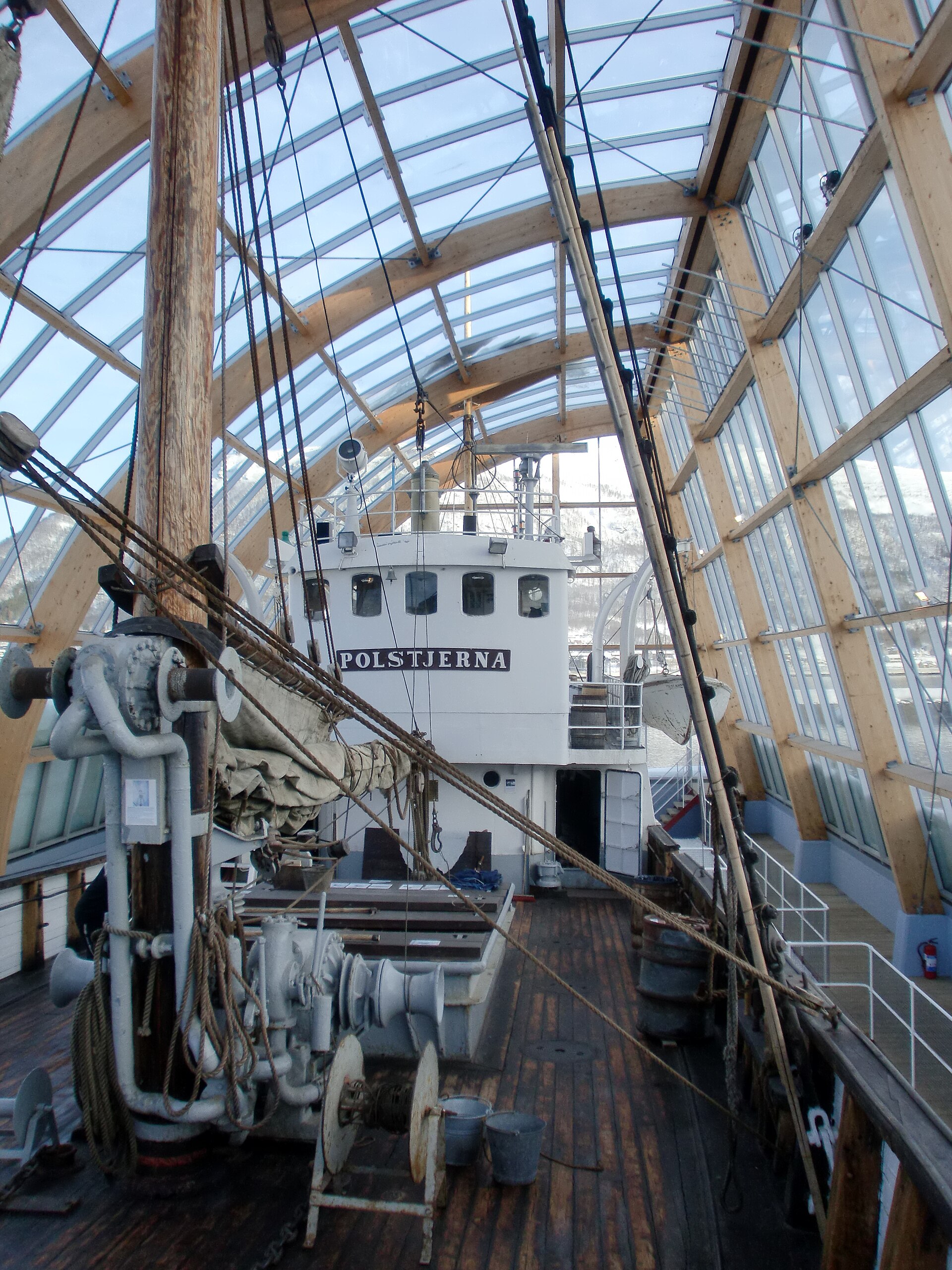 Original deck, rigging and wheelhouse of MS Polstjerna inside its glass enclosure