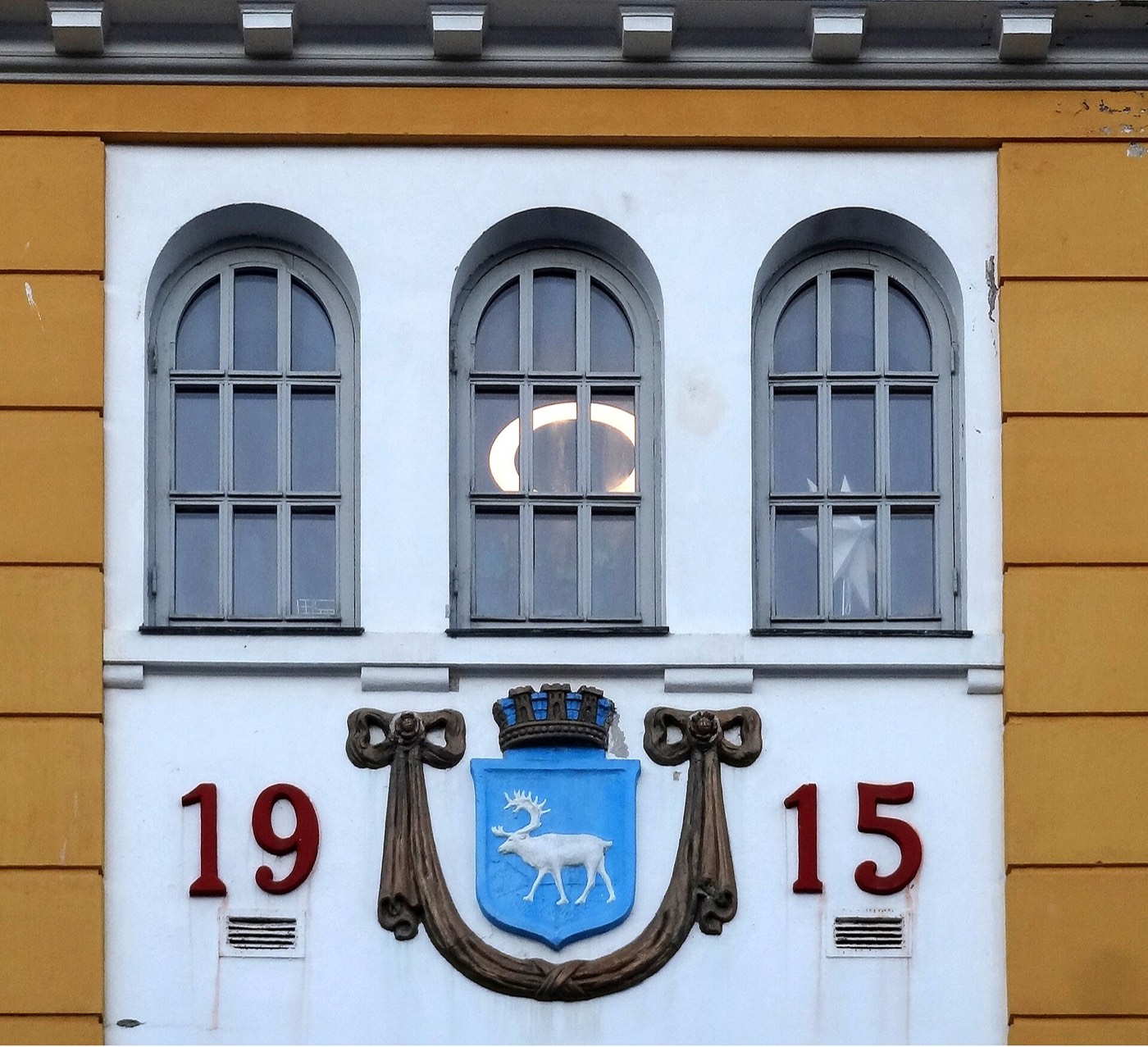Decorative Tromsø coat of arms above the Verdensteatret cinema entrance