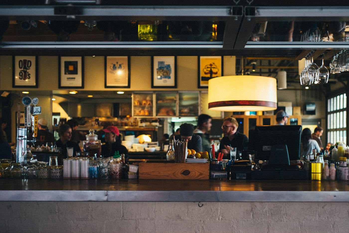 People at a café counter; illustrative photograph taken outside Tromsø