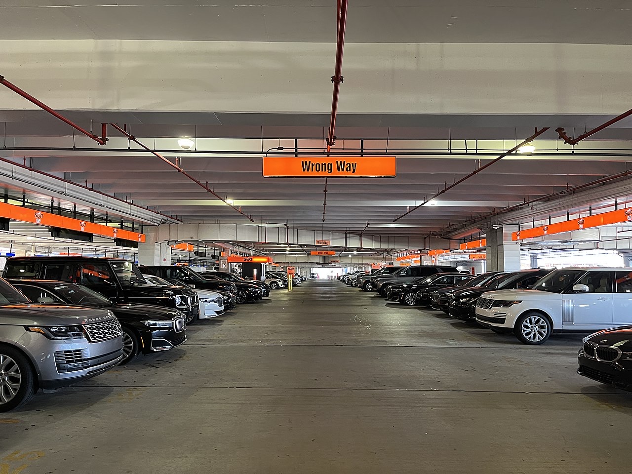 Rows of vehicles in a Sixt airport pickup area