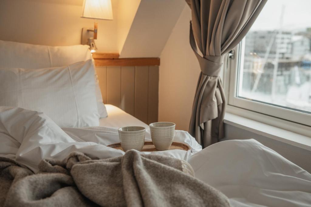 Bed beside the window — Home Hotel With