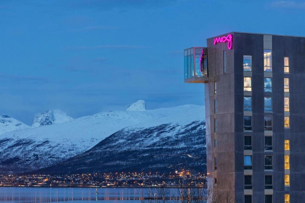 Hotel and mountain backdrop — Moxy Tromsø