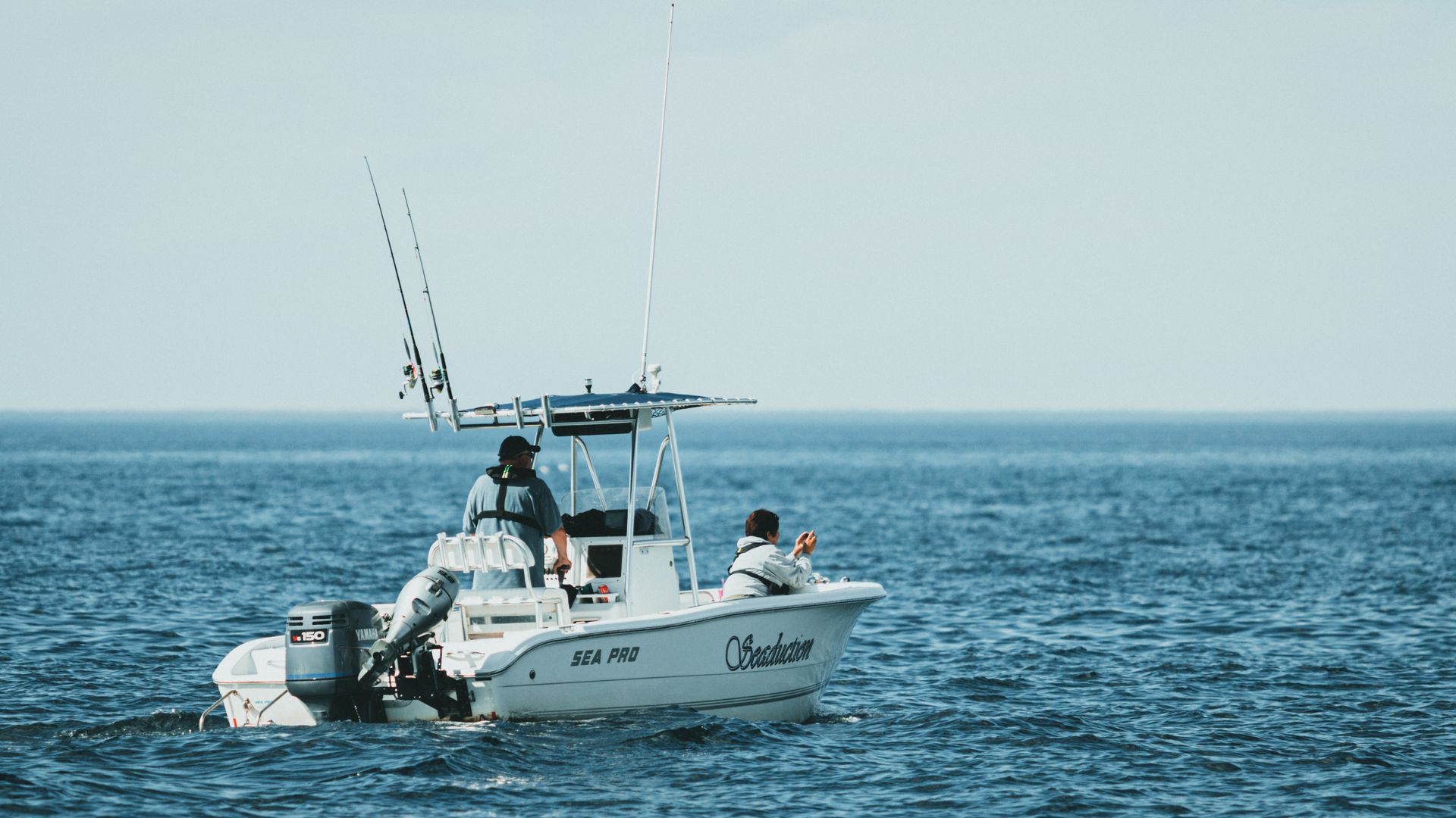 People fishing from a boat on the sea