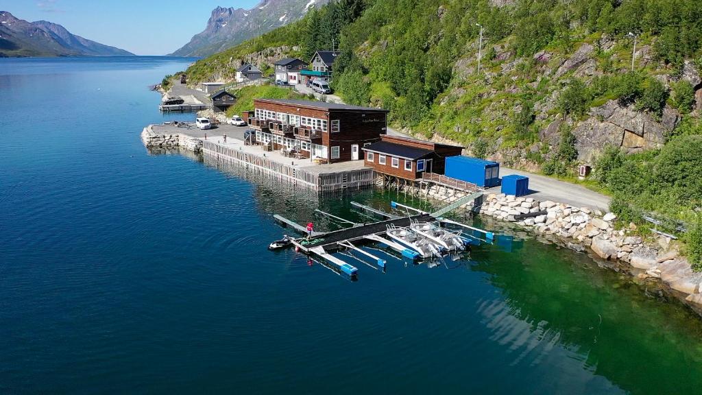 an aerial view of a dock with boats in the water at Ersfjordbotn Brygge in Ersfjordbotn — Ersfjordbotn Brygge