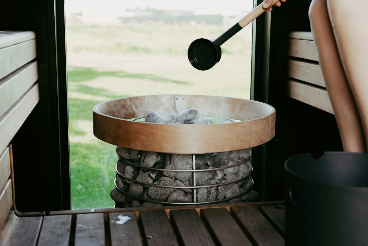 Illustrative photograph of sauna stones; not The HotSpot in Tromsø